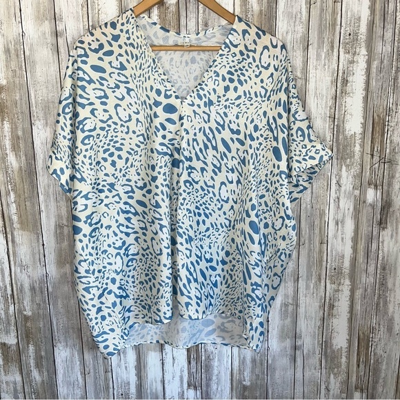 JODIFL Tops - Jodifl Cream & Blue Animal Print Oversized Whimsy Blouse
